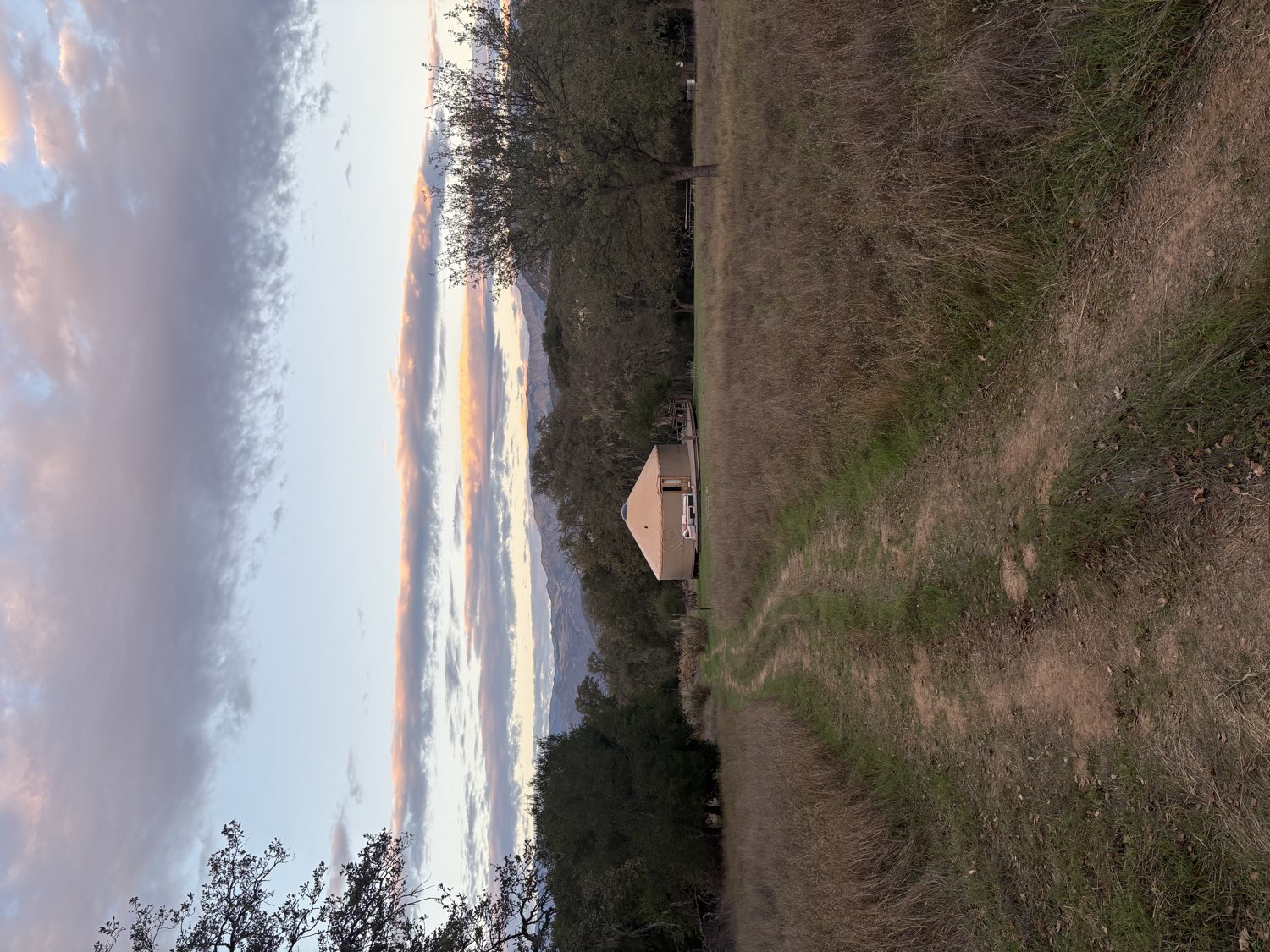 The gathering yurt on the land at dusk